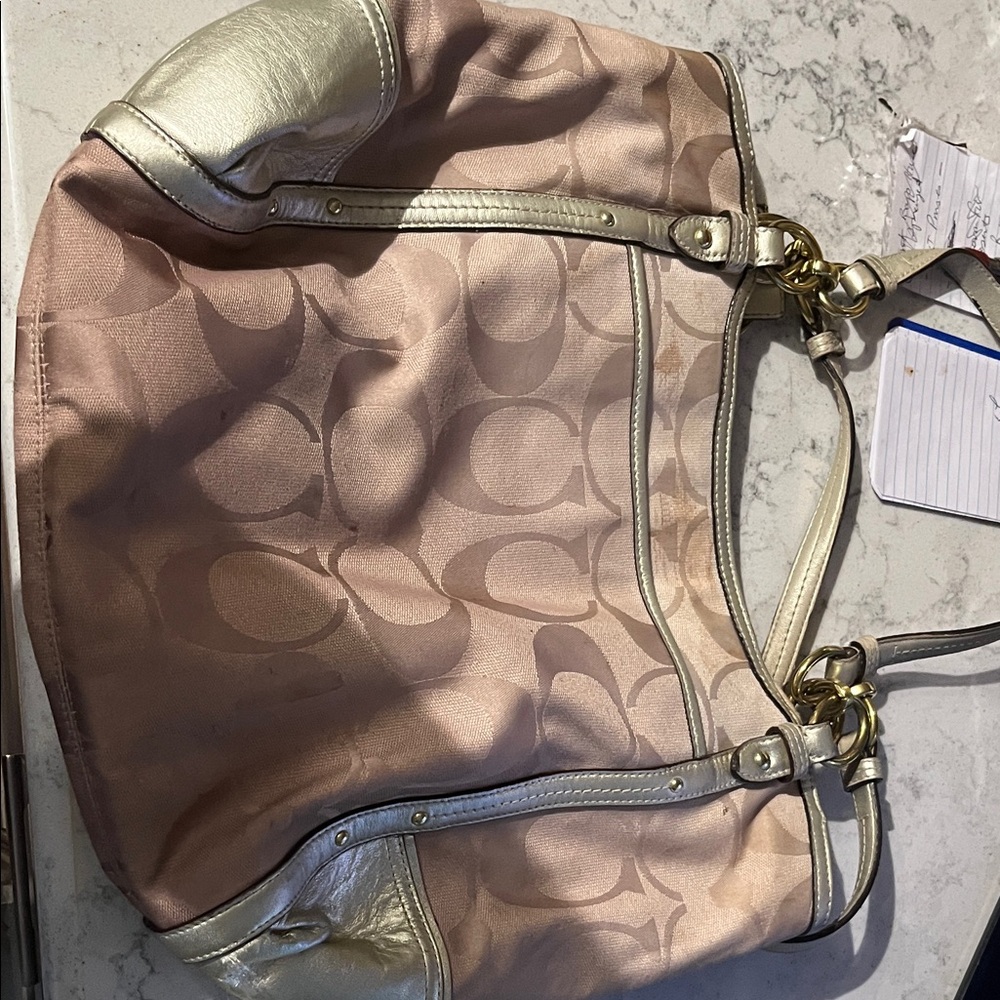 Coach bag with gold accents.